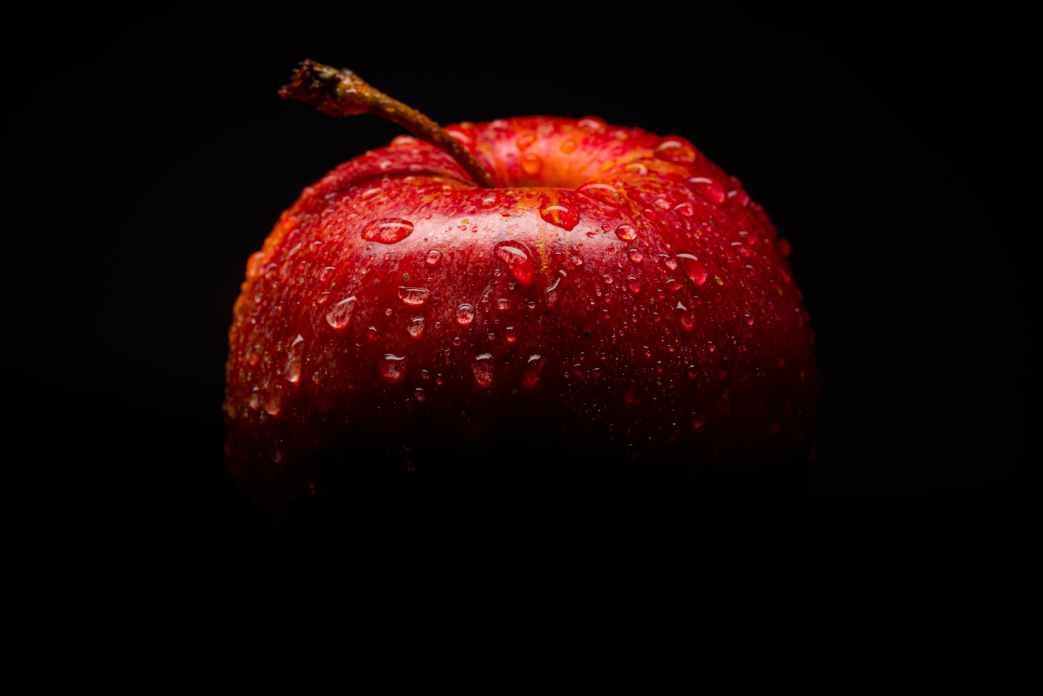 red apple fruit with black background